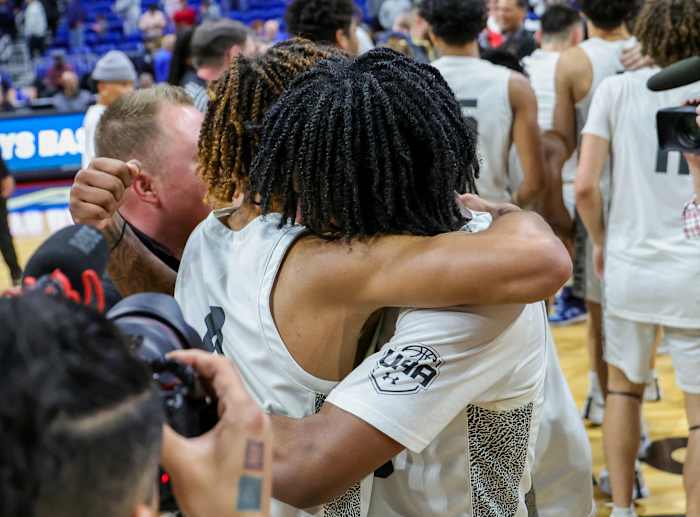 Plano East players embrace in the celebratory moments after clinching a UIL 6A state title, perfect 40-0 season on Saturday at the Alamodome in San Antonio.